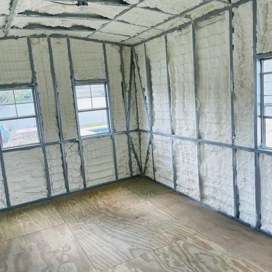 Closed-cell spray foam insulation applied to wall cavities in a residential project in Chain Lake
